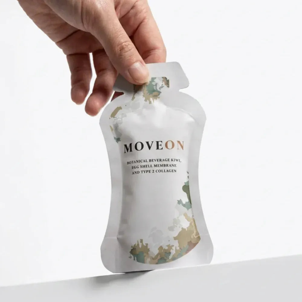 A hand holding a MoveOn sachet